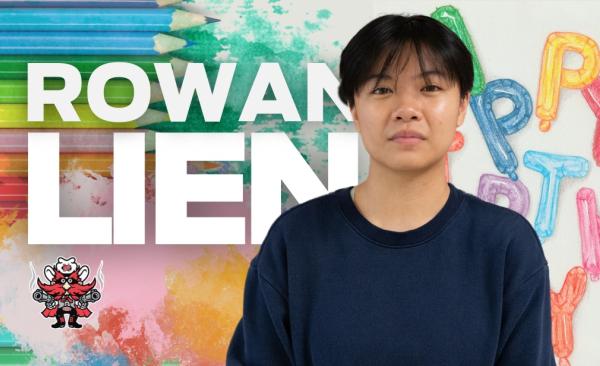 Rowan Lien stands in front of a colorful background with his name written in block text behind him